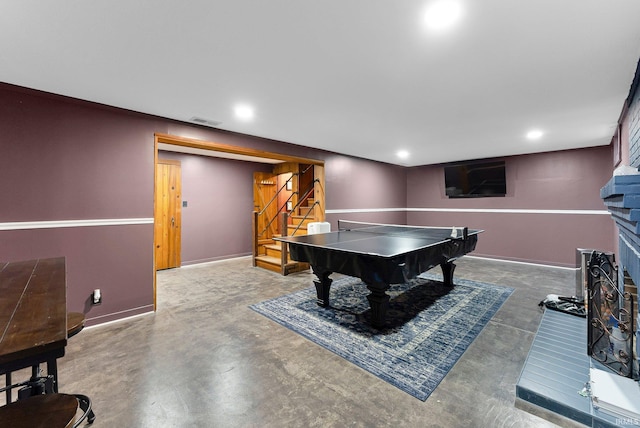 4707 Old Mill Rd, Fort Wayne, IN 46807 - rec room with concrete floors, baseboards, recessed lighting, a fireplace with raised hearth, and visible vents