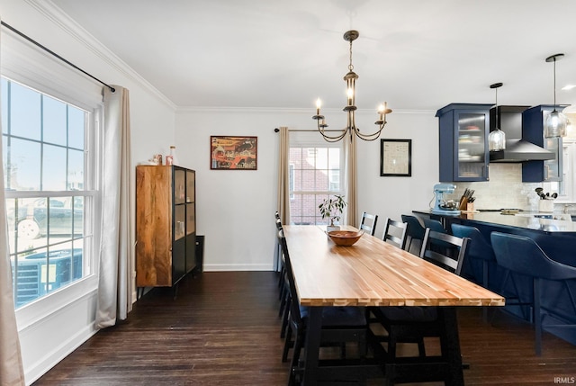 4707 Old Mill Rd, Fort Wayne, IN 46807 - dining space featuring a chandelier, crown molding, baseboards, and dark wood-style floors