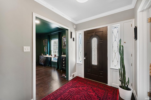 4707 Old Mill Rd, Fort Wayne, IN 46807 - foyer with dark wood-type flooring, baseboards, ornamental molding, and visible vents