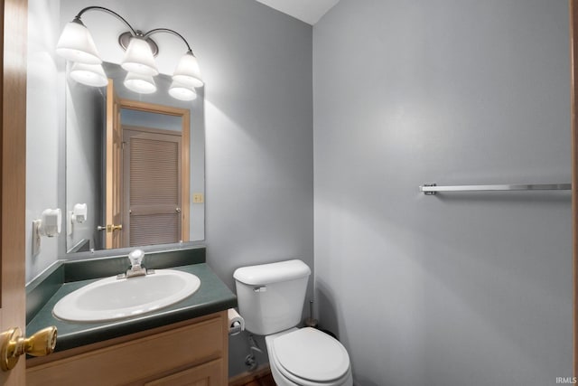 bathroom with toilet and vanity