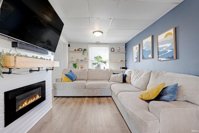 604 Short St, Decatur, IN 46733 - living room with a glass covered fireplace, a paneled ceiling, and wood finished floors