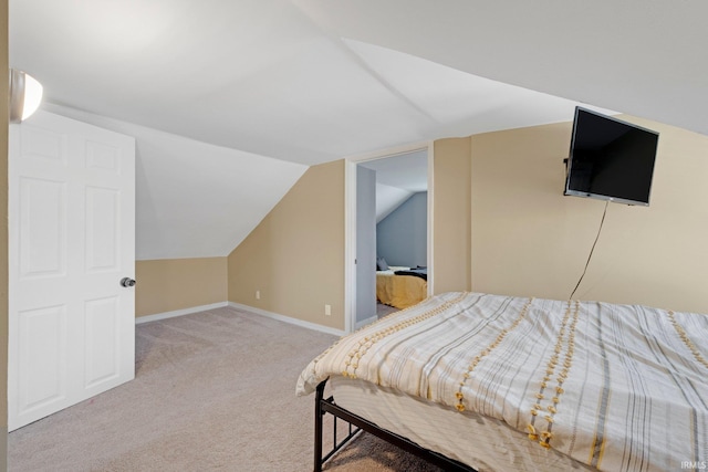 604 Short St, Decatur, IN 46733 - bedroom featuring lofted ceiling, baseboards, and light colored carpet