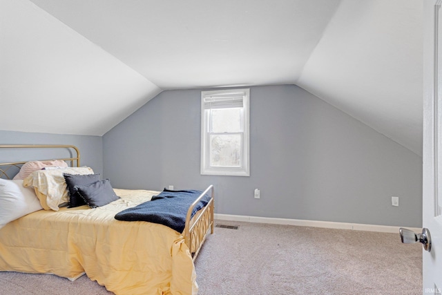604 Short St, Decatur, IN 46733 - bedroom featuring vaulted ceiling, visible vents, and carpet floors