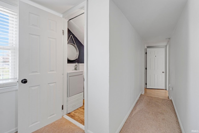 604 Short St, Decatur, IN 46733 - corridor featuring light colored carpet, baseboards, and a sink