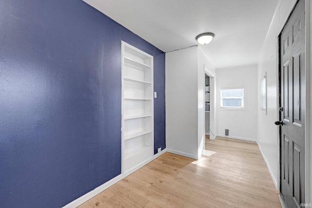 604 Short St, Decatur, IN 46733 - hall with light wood-style floors, baseboards, and built in shelves