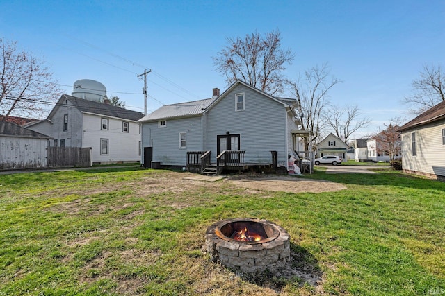 604 Short St, Decatur, IN 46733 - back of house featuring a lawn, a fire pit, and a chimney