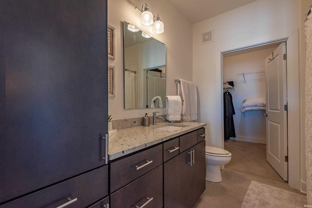 304 W Kirkwood Ave Unit 305, Bloomington, IN 47404 - full bathroom with tile patterned floors, vanity, visible vents, and toilet