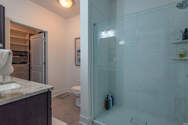 304 W Kirkwood Ave Unit 305, Bloomington, IN 47404 - full bath featuring toilet, baseboards, a shower stall, and vanity