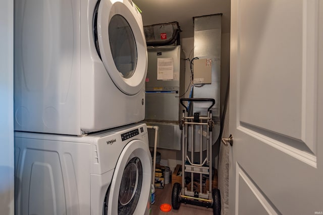304 W Kirkwood Ave Unit 305, Bloomington, IN 47404 - laundry area featuring stacked washer / drying machine, laundry area, and wood finished floors