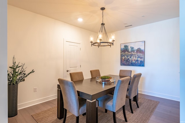 304 W Kirkwood Ave Unit 305, Bloomington, IN 47404 - dining area with visible vents, baseboards, an inviting chandelier, and dark wood-style floors