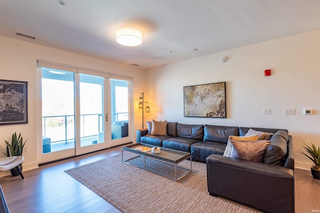 304 W Kirkwood Ave Unit 305, Bloomington, IN 47404 - living room with wood finished floors, baseboards, and visible vents