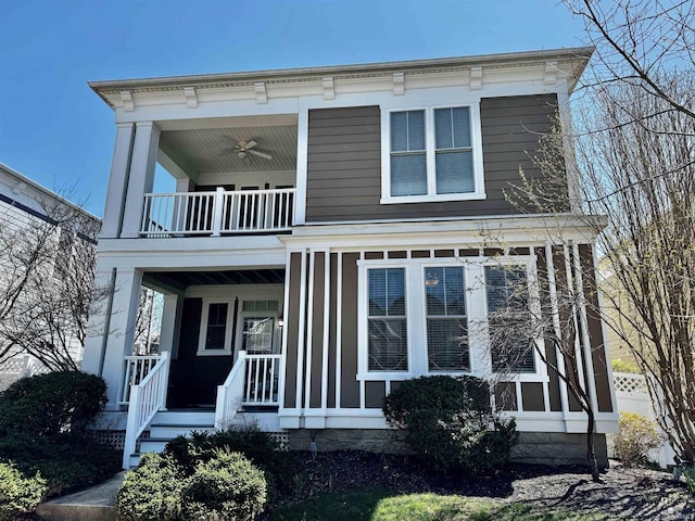 view of front of home featuring a porch, a ceiling fan, and a balcony
