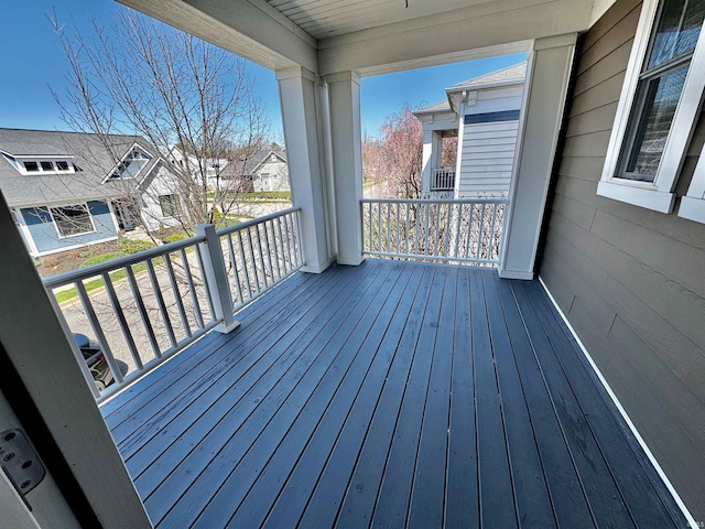 wooden terrace featuring a residential view