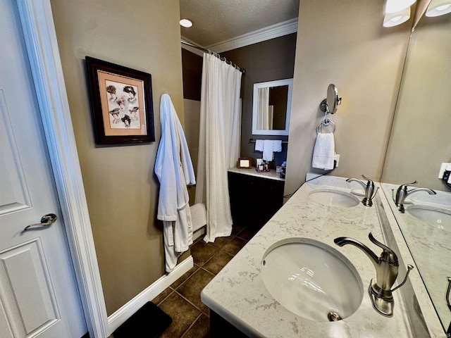 full bath featuring tile patterned floors, a sink, and ornamental molding