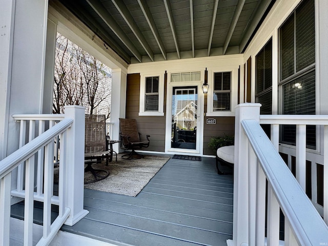 wooden deck featuring a porch