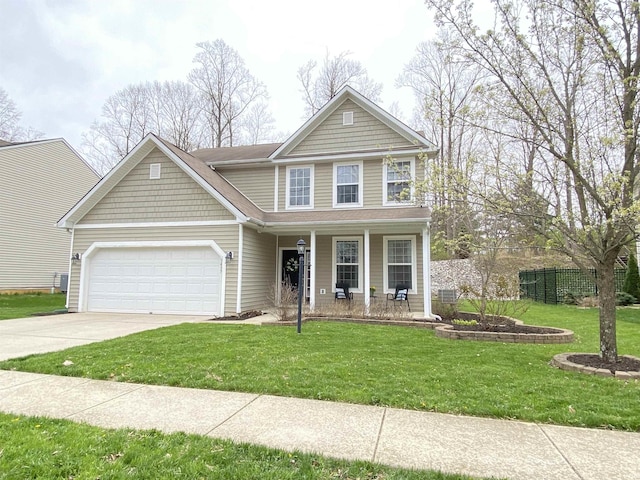 traditional home with a garage, a front yard, a porch, and concrete driveway