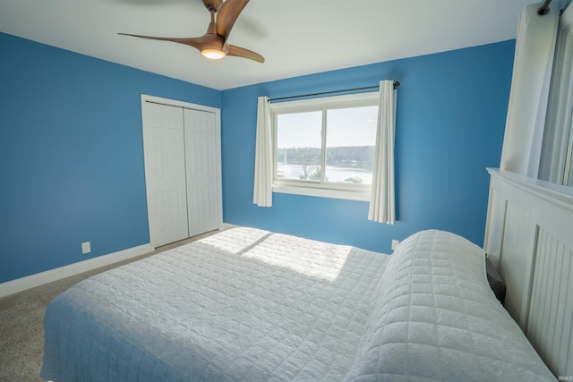5793 E Pierce Rd, Monticello, IN 47960 - carpeted bedroom featuring a closet, baseboards, and a ceiling fan