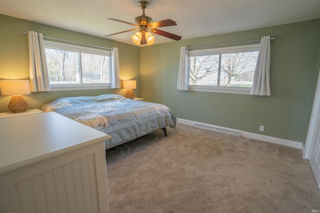 5793 E Pierce Rd, Monticello, IN 47960 - carpeted bedroom featuring a ceiling fan, baseboards, and multiple windows