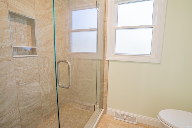 5793 E Pierce Rd, Monticello, IN 47960 - full bathroom featuring toilet, visible vents, baseboards, and a stall shower