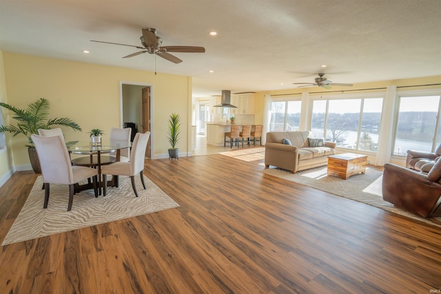 5793 E Pierce Rd, Monticello, IN 47960 - living area with a ceiling fan, a water view, recessed lighting, wood finished floors, and baseboards