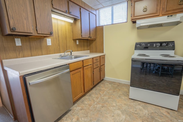5793 E Pierce Rd, Monticello, IN 47960 - kitchen with electric range, under cabinet range hood, brown cabinets, dishwasher, and a sink