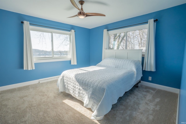 5793 E Pierce Rd, Monticello, IN 47960 - carpeted bedroom featuring ceiling fan and baseboards