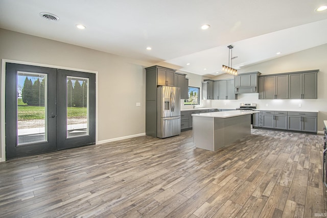 8342 S Sr 17 Hwy, Plymouth, IN 46563 - kitchen featuring gray cabinets, french doors, wood finished floors, and appliances with stainless steel finishes