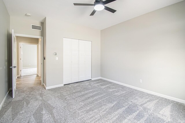 8342 S Sr 17 Hwy, Plymouth, IN 46563 - unfurnished bedroom with a closet, baseboards, a ceiling fan, visible vents, and carpet