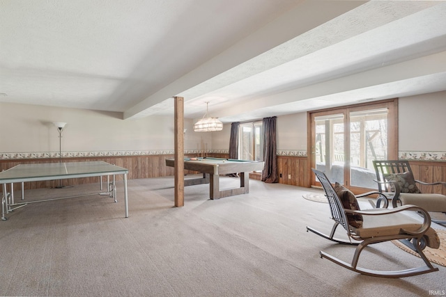 rec room with a wainscoted wall, wood walls, carpet floors, and billiards