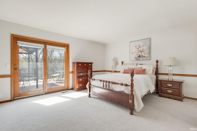bedroom featuring baseboards, carpet flooring, and access to exterior