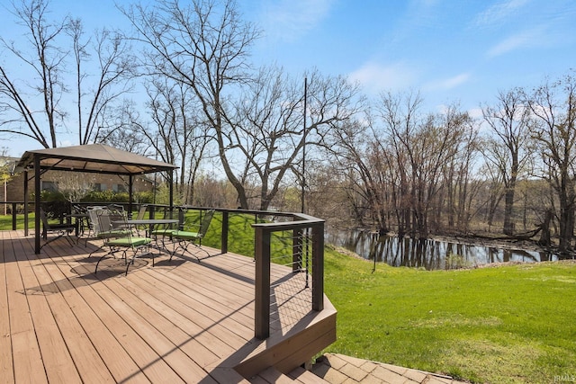 deck with a gazebo, a water view, a yard, and outdoor dining space