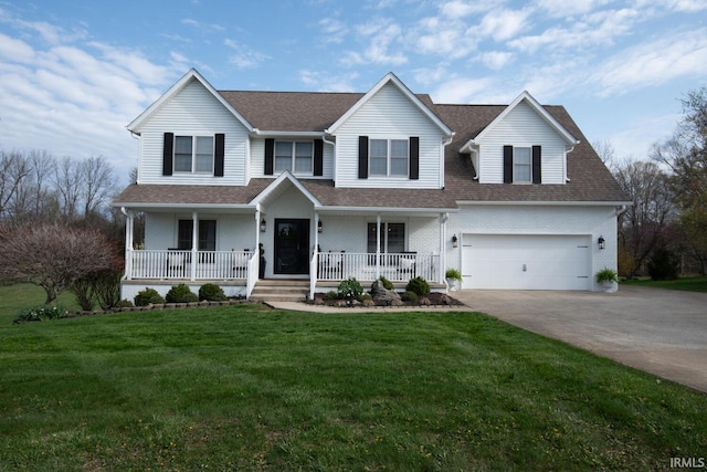 traditional-style home featuring a porch, roof with shingles, a front yard, brick siding, and concrete driveway