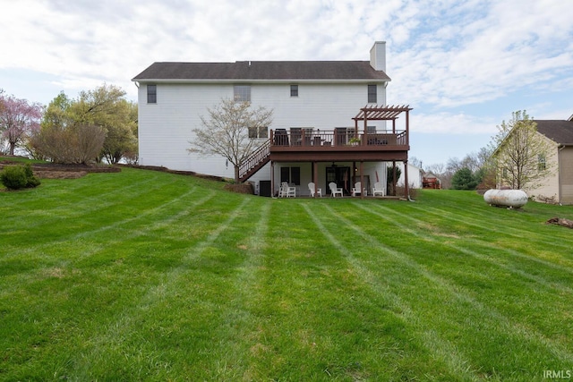 back of property with a pergola, a lawn, a chimney, stairway, and a wooden deck