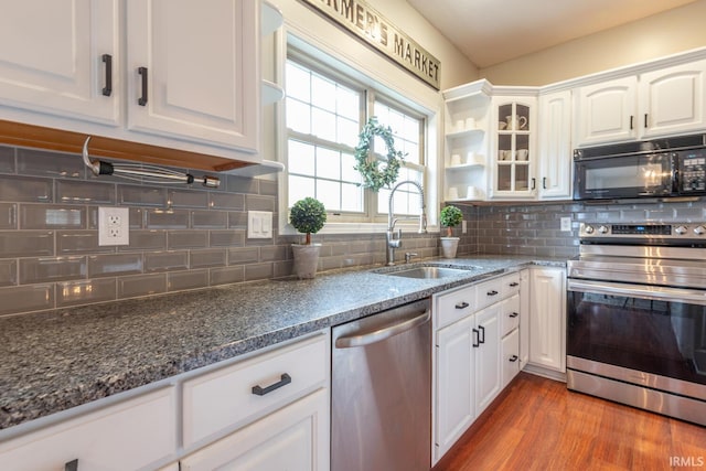 kitchen featuring a sink, white cabinetry, and stainless steel appliances