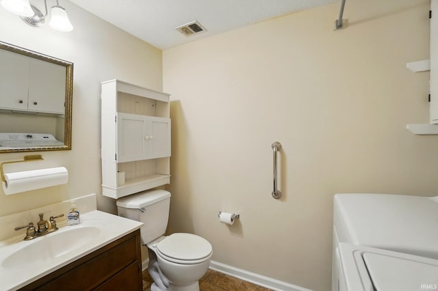 bathroom featuring visible vents, baseboards, toilet, vanity, and tile patterned floors
