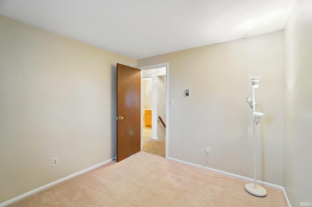 unfurnished bedroom with carpet floors and baseboards