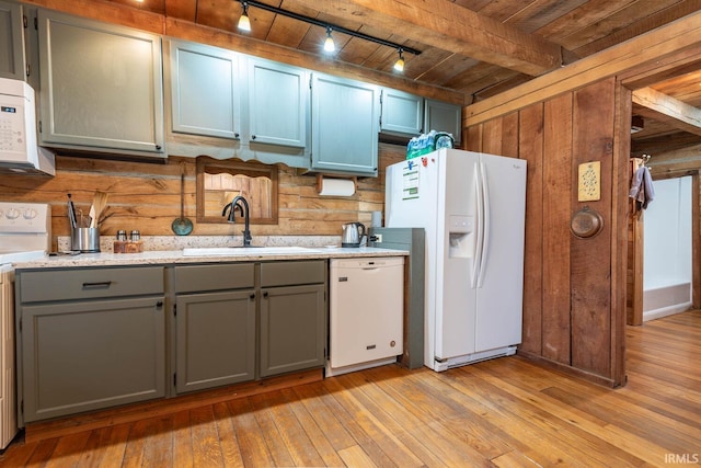 3066 N Pierce Dr, Solsberry, IN 47459 - kitchen featuring a sink, gray cabinets, white appliances, and wood walls