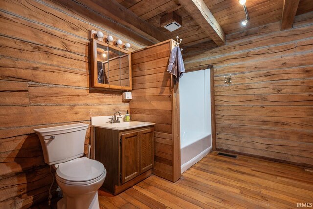 3066 N Pierce Dr, Solsberry, IN 47459 - bathroom with toilet, wood ceiling, wooden walls, beamed ceiling, and wood-type flooring