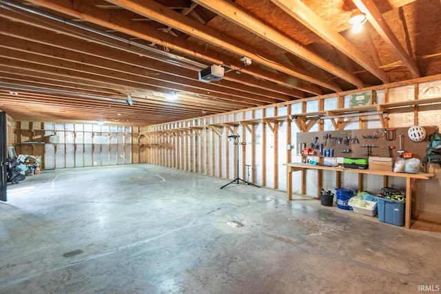 3066 N Pierce Dr, Solsberry, IN 47459 - interior space featuring a garage door opener and a workshop area