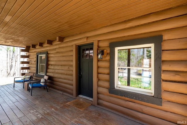 3066 N Pierce Dr, Solsberry, IN 47459 - wooden deck featuring a porch