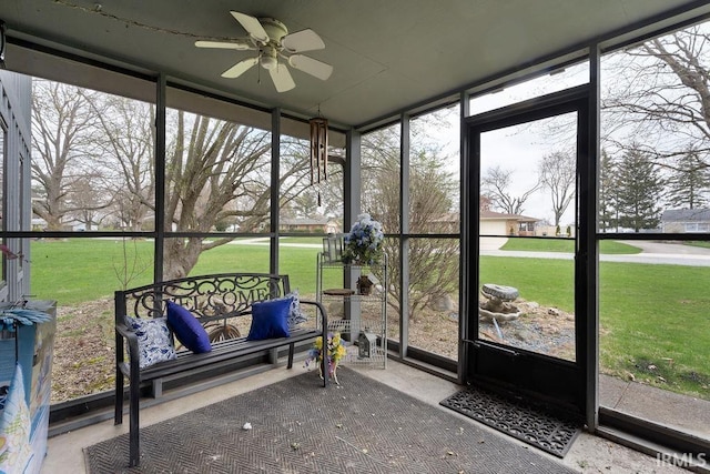 sunroom with a ceiling fan