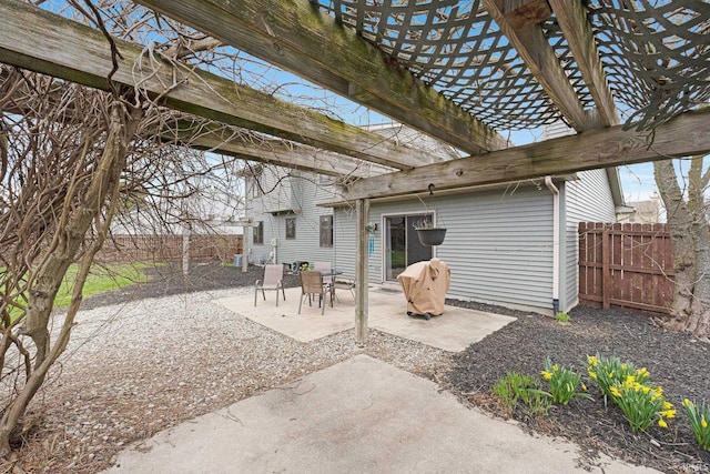 view of patio / terrace featuring fence and a pergola