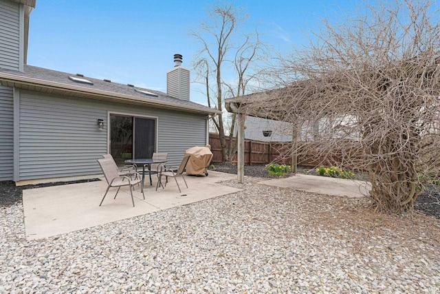 view of patio / terrace featuring fence