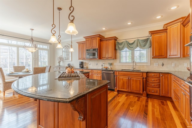 6455 Water Stone Ct, Newburgh, IN 47630 - kitchen featuring crown molding, a sink, wood-type flooring, and stainless steel appliances