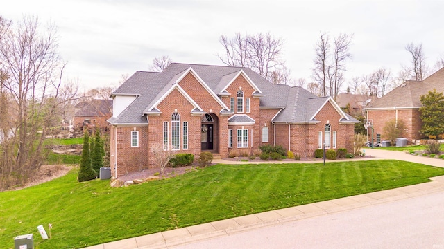 6455 Water Stone Ct, Newburgh, IN 47630 - view of front of home featuring roof with shingles, a front yard, and brick siding
