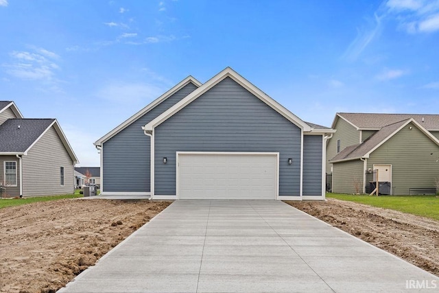 ranch-style home featuring a garage and driveway