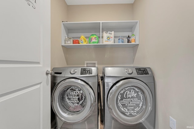 laundry room featuring independent washer and dryer and laundry area