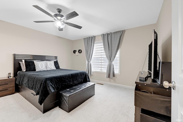 bedroom with baseboards, a ceiling fan, and carpet flooring