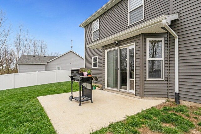 view of patio / terrace with a grill and fence