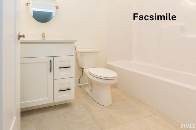 bathroom with vanity, baseboards, toilet, and shower / washtub combination